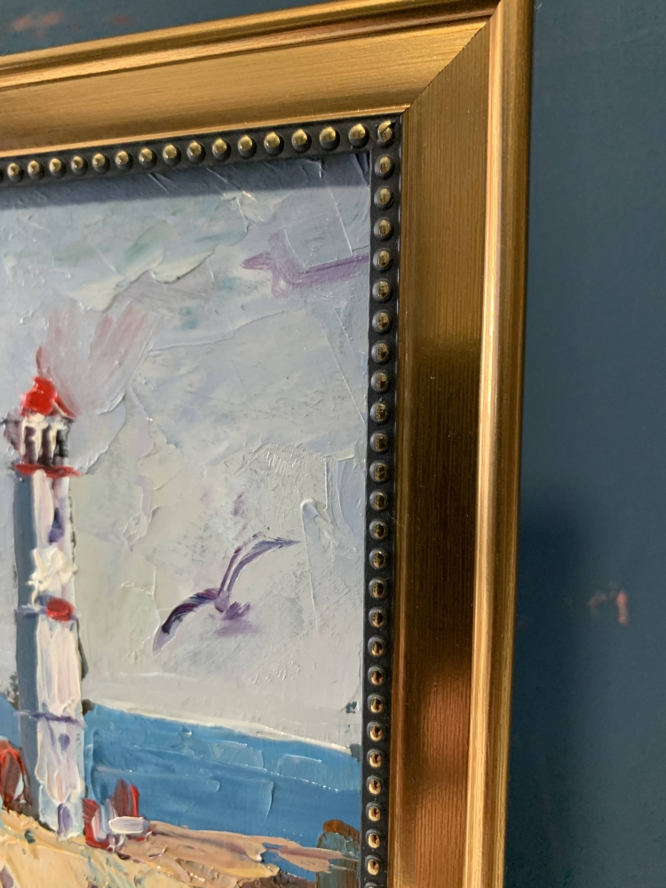 Seascape with lighthouse and waves