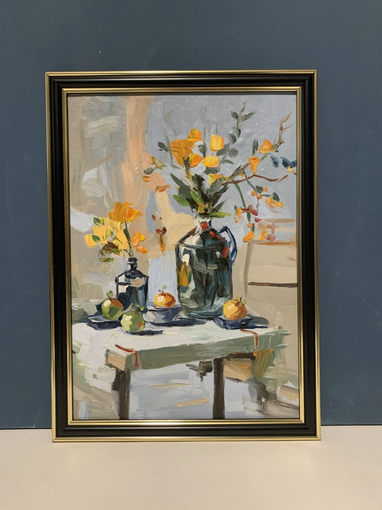 Yellow flowers in a black vase.