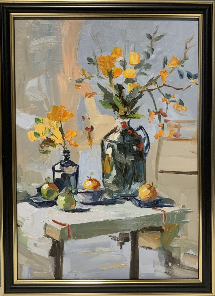 Yellow flowers in a black vase.