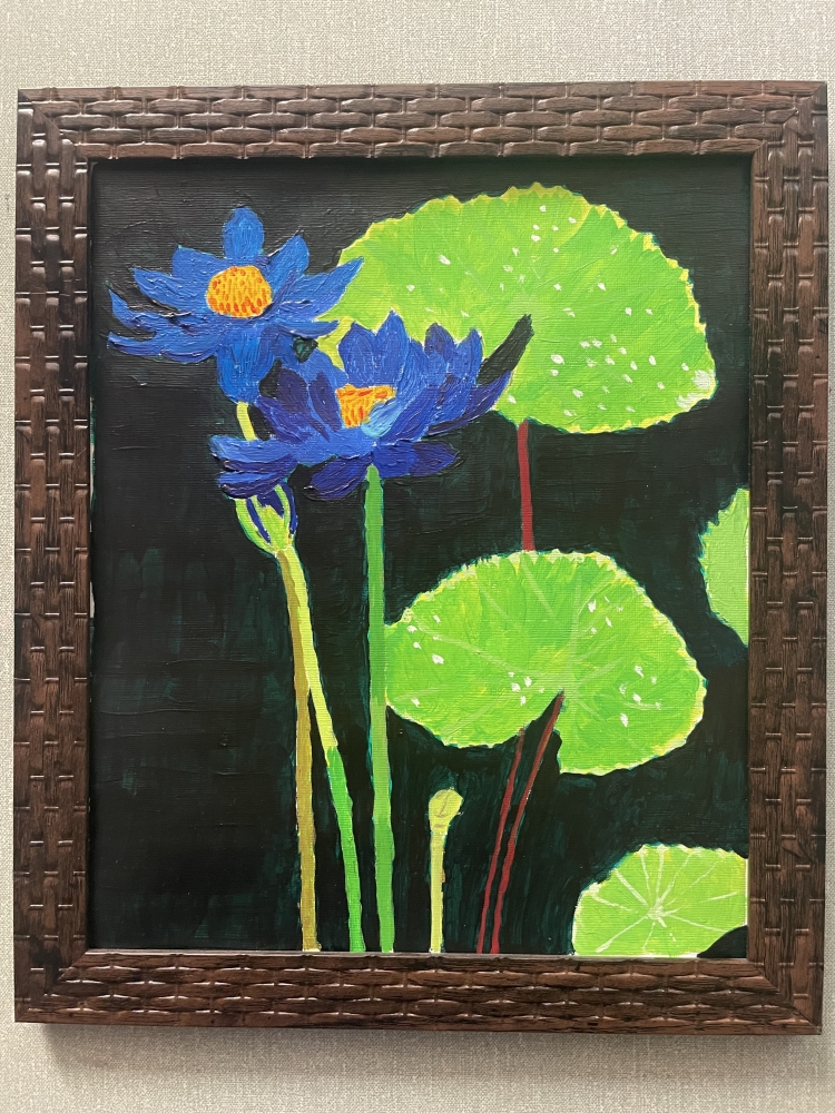 A pair of purplish-blue water lilies 