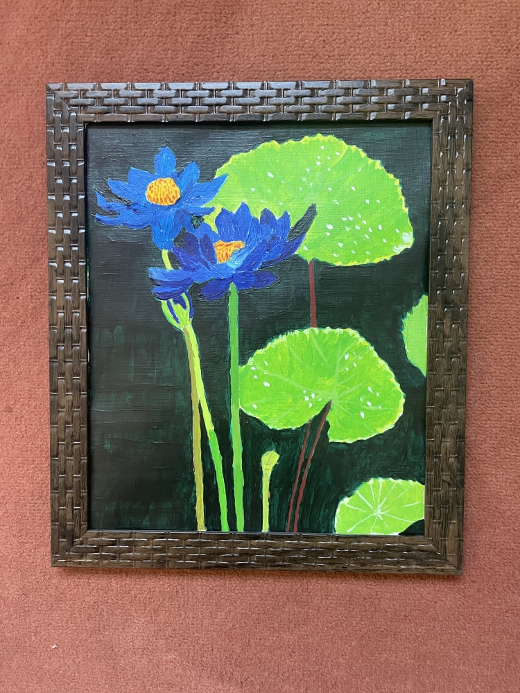 A pair of purplish-blue water lilies 