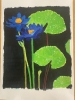 A pair of purplish-blue water lilies 