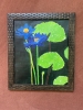 A pair of purplish-blue water lilies 