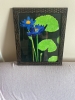 A pair of purplish-blue water lilies 