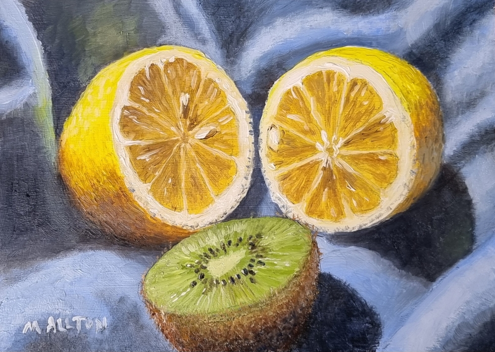 Lemon and Kiwi Fruit on Blue Cloth