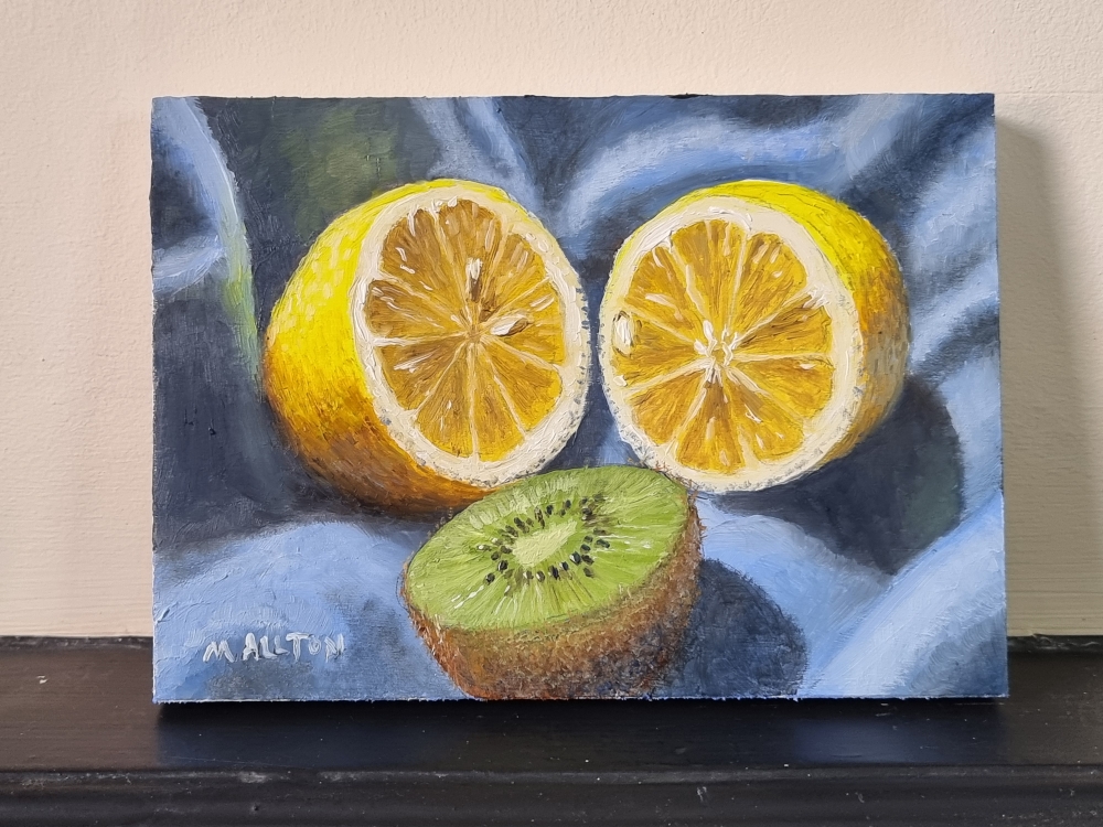 Lemon and Kiwi Fruit on Blue Cloth