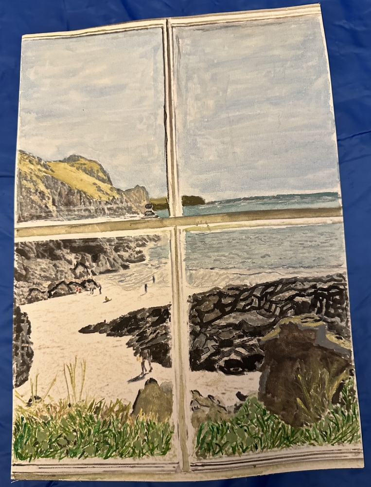 Veiw through a window of a coastal path 