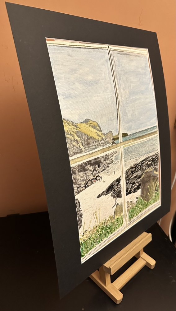 Veiw through a window of a coastal path 