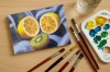 Lemon and Kiwi Fruit on Blue Cloth