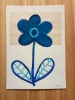 Five flowers in a vase and Blue plant