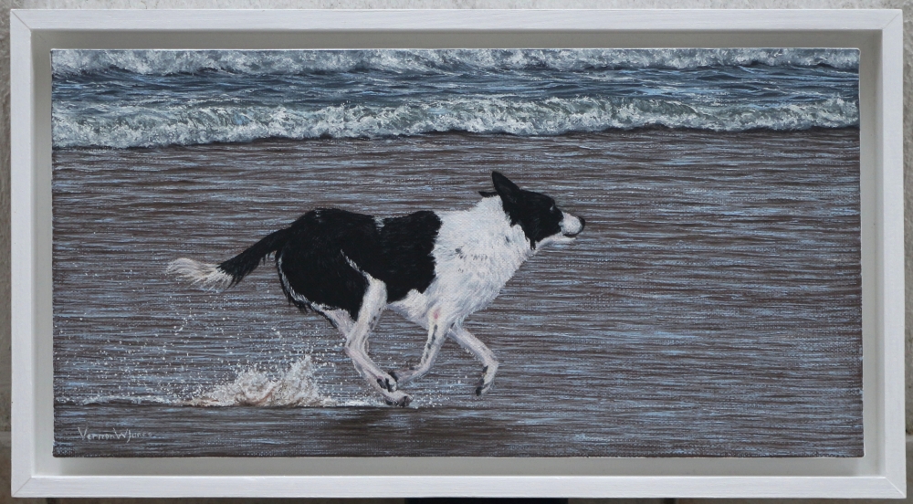 \"Dog running on Beach\"