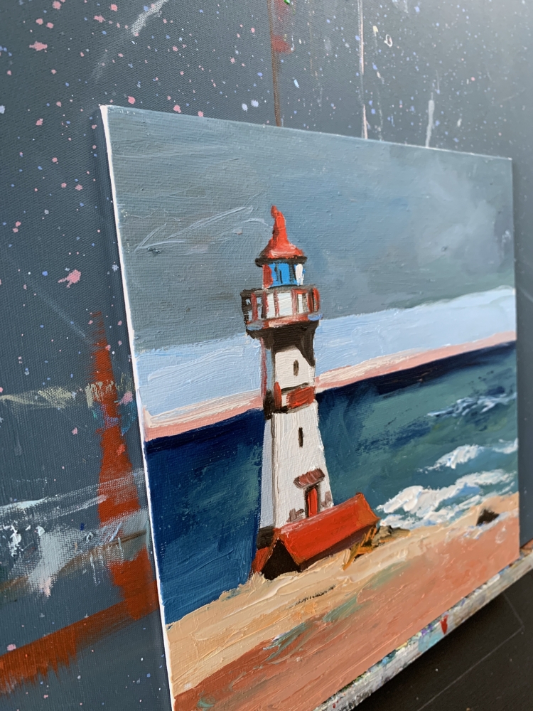 Seascape with lighthouse on a sea shore