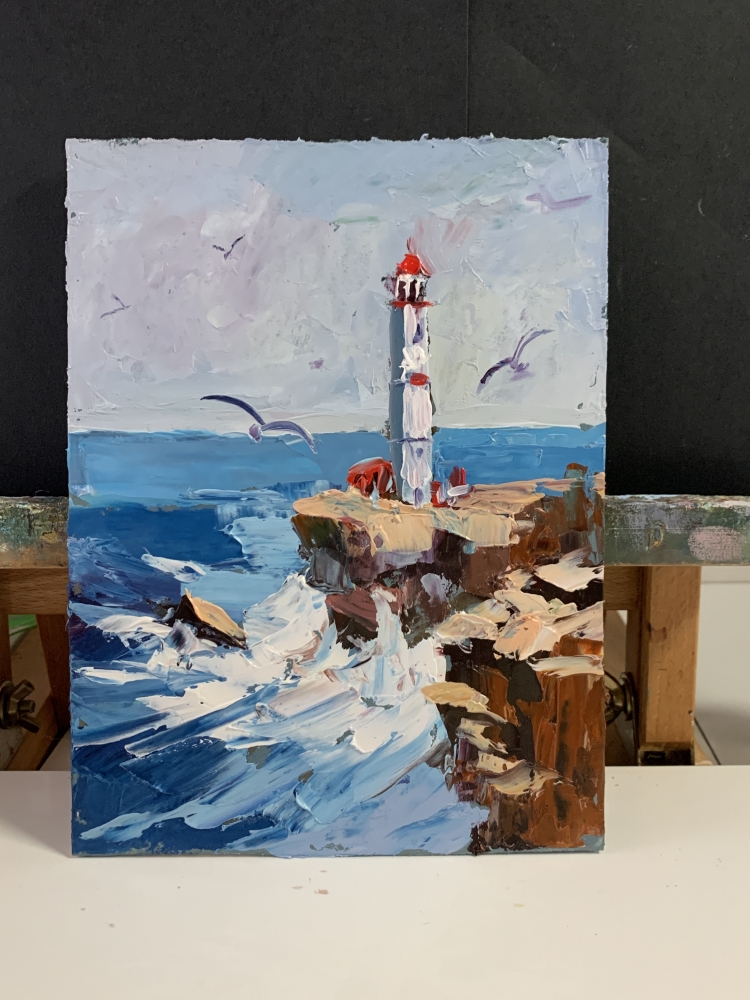 Seascape with lighthouse and waves