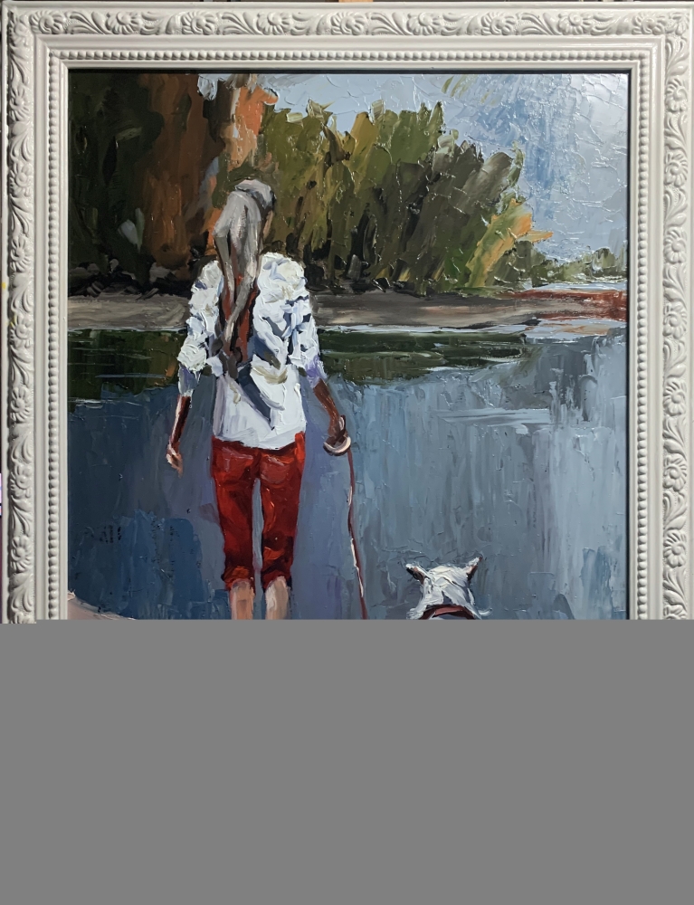 Woman walking with a dog.