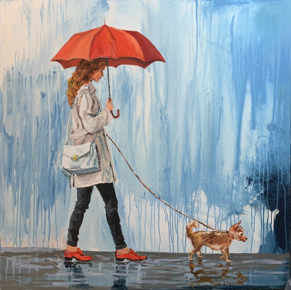 Woman walking with a dog.