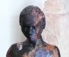 Woman, sculpture made in clay and painted with an abstract pattern