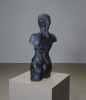 Woman, sculpture made in clay and painted with an abstract pattern
