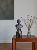 Woman, sculpture made in clay and painted with an abstract pattern