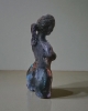 Woman, sculpture made in clay and painted with an abstract pattern