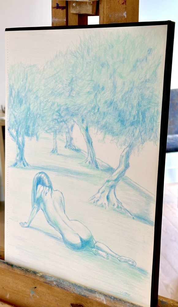 Nude resting on an olive tree beach
