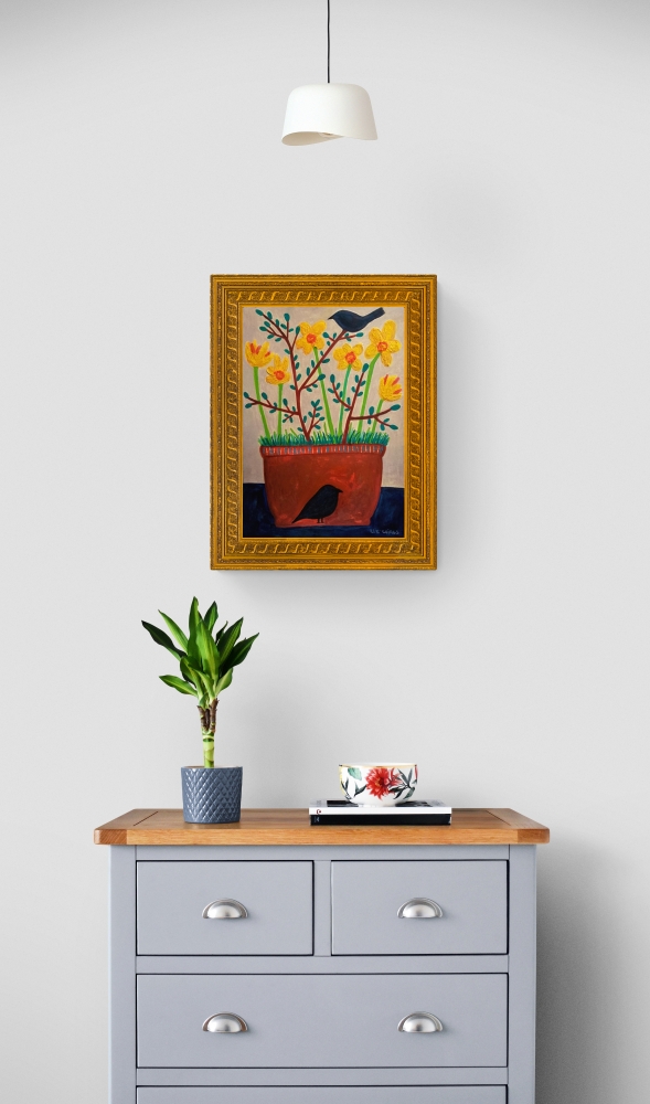 Terracotta pot with daffodils and blackbirds