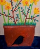 Terracotta pot with daffodils and blackbirds