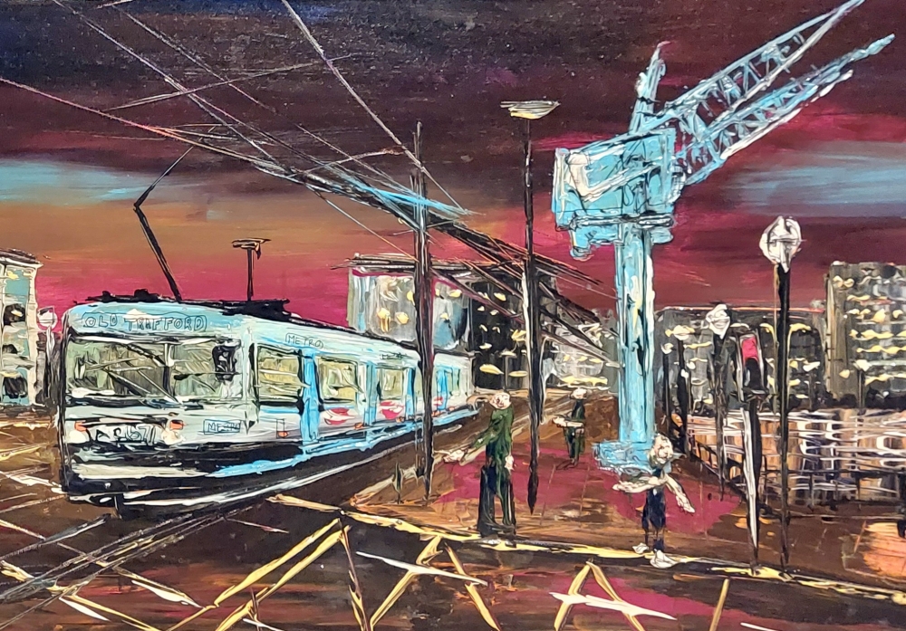 Blue Cranes and tram Salford by night