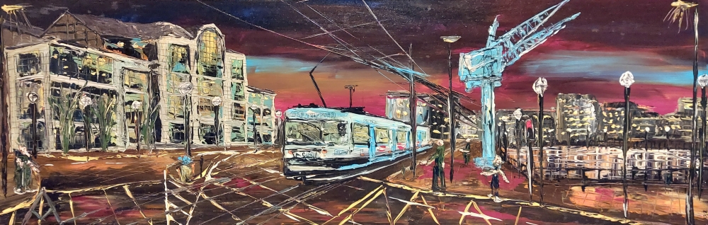 Blue Cranes and tram Salford by night