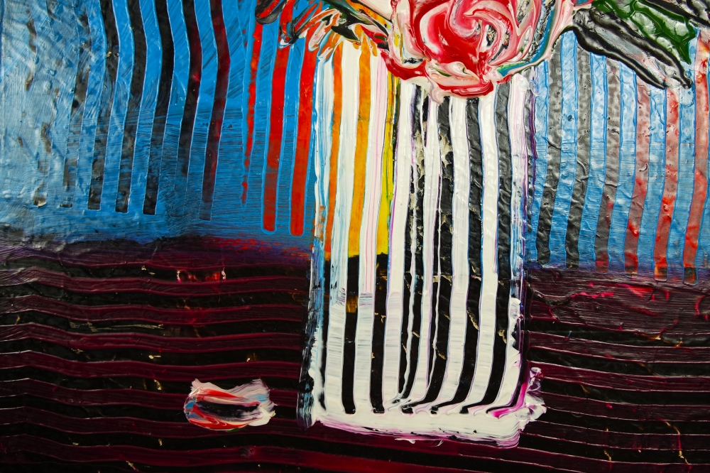 Flowers in tall vase on table expressions 810