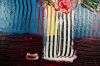 Flowers in tall vase on table expressions 810