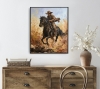 Cowboy on a Black Horse Across a Dusty Prairie.
