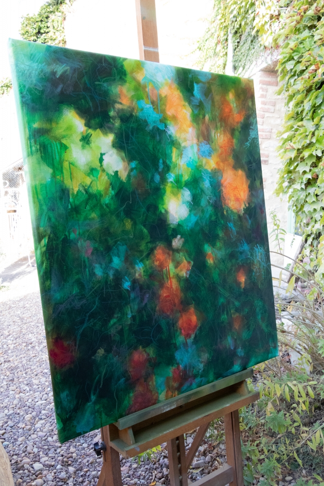 Orange and green rosebush