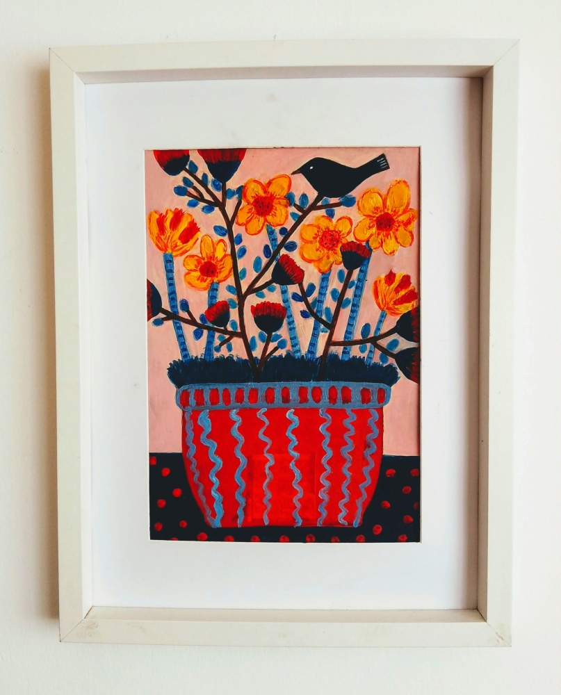 Pot of daffodils and a blackbird