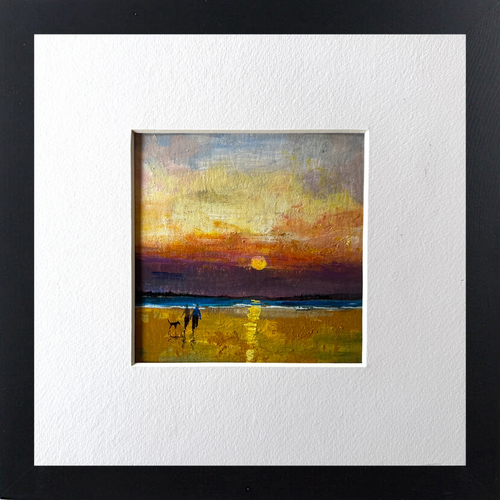 Couple on beach with dog framed
