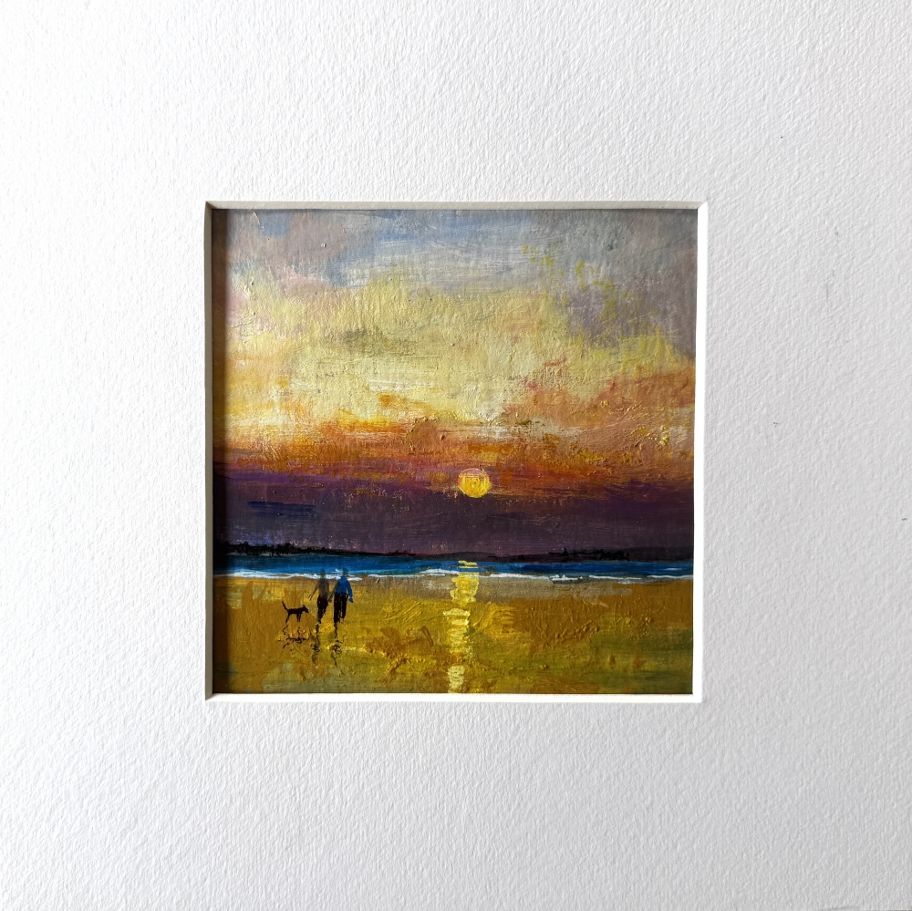 Couple on beach with dog framed