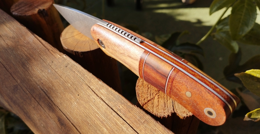 Mixed wood handle friction folder