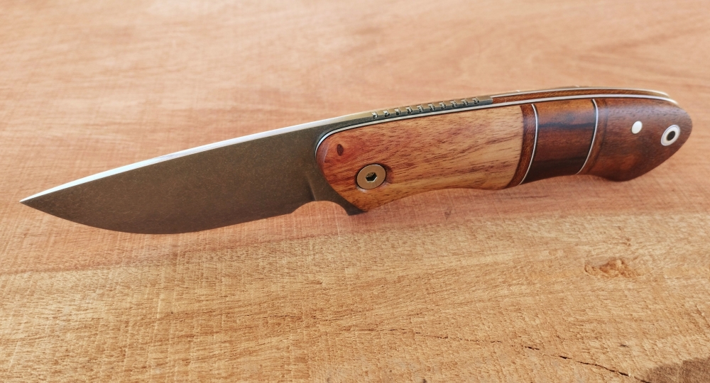 Mixed wood handle friction folder