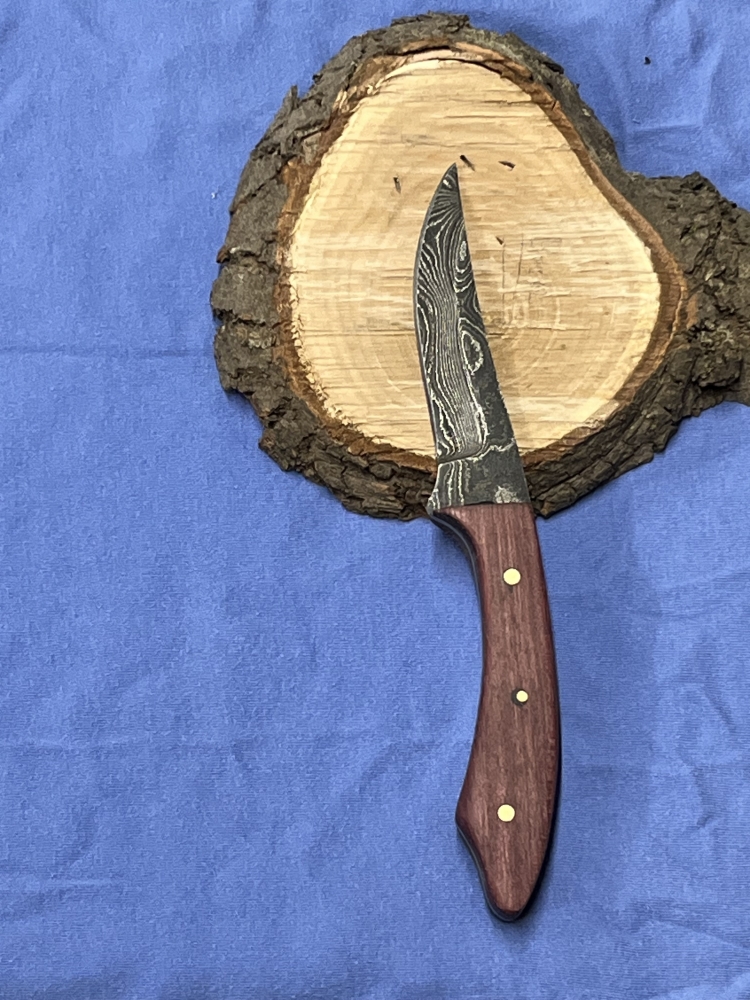 Purple Heart Damascus trailing point