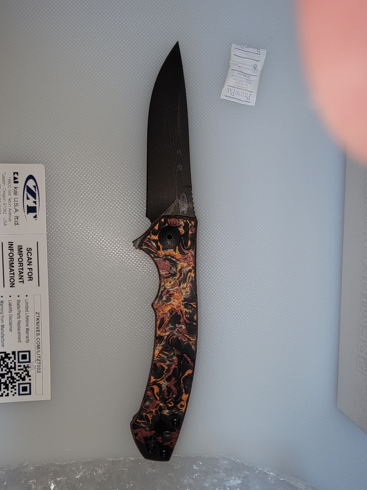 Zero Tolerance: 0450CFDAMS Limited Edition - Orange & Red Marbled Multi Carbon - Vegas Forge Stainless - Titanium Framelock