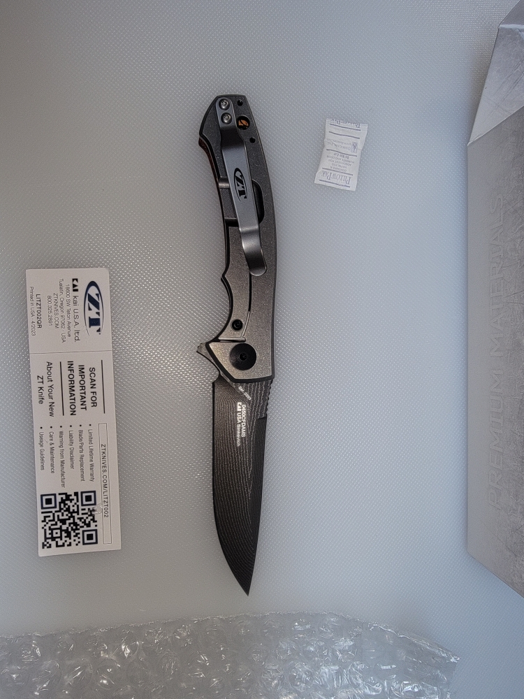 Zero Tolerance: 0450CFDAMS Limited Edition - Orange & Red Marbled Multi Carbon - Vegas Forge Stainless - Titanium Framelock
