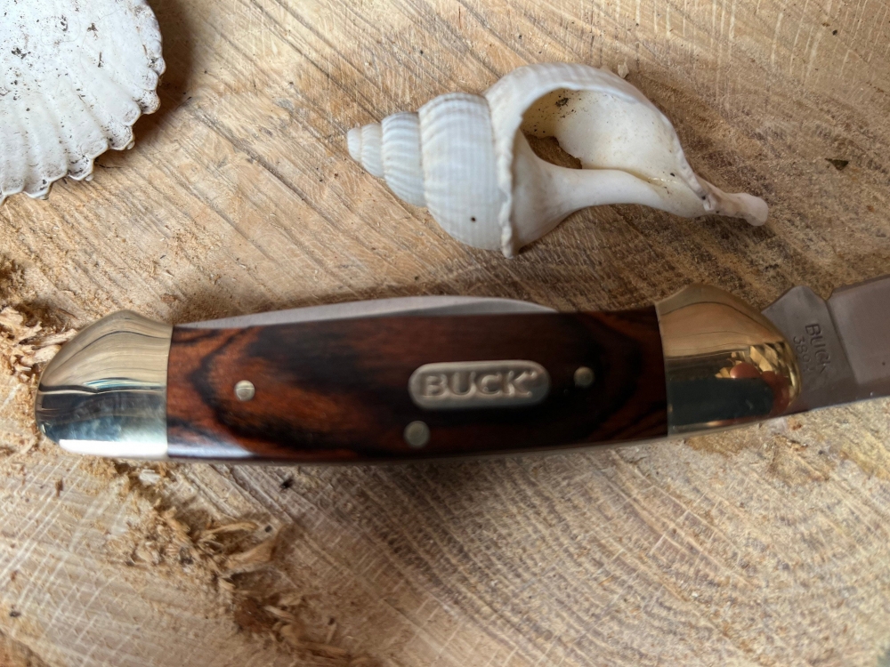 Buck 'Canoe' Nickel silver bolsters wood centre. Two stainless blades 2 1/2\" & 1 7/8\"