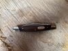 Buck Solo small easy opening occasional use pocket knife in wood grain & silver