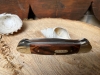 Buck 'Canoe' Nickel silver bolsters wood centre. Two stainless blades 2 1/2\" & 1 7/8\"