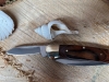 Buck 'Canoe' Nickel silver bolsters wood centre. Two stainless blades 2 1/2\" & 1 7/8\"