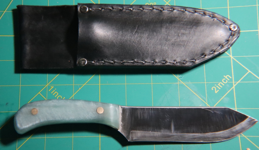 1095 Clip Point Hunter + Welted Leather Sheath — Metallic Blue Epoxy Scales