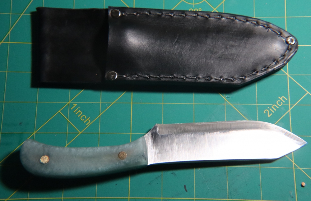 1095 Clip Point Hunter + Welted Leather Sheath — Metallic Blue Epoxy Scales