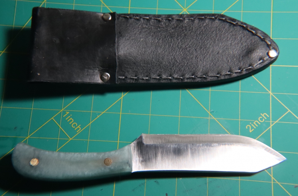 1095 Clip Point Hunter + Welted Leather Sheath — Metallic Blue Epoxy Scales