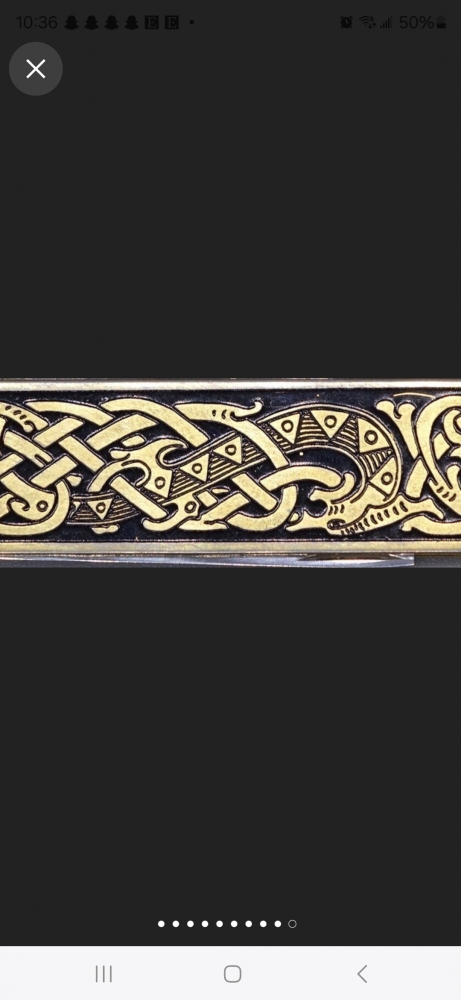 Vintage Gentlemen's knife. Made in Sweeden.  Gold plated. With Sweeden National Emblem and lacquered black Viking runes on the other side. 