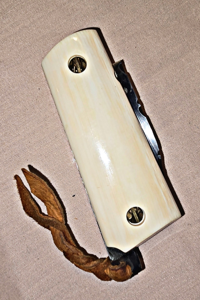 Hand made COLT 45 grips by Gene Barnett ⁹in fossil Mammoth tusk with SCRIMSHAW of native American by Gary Williams 