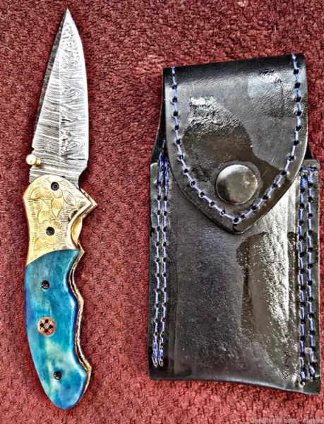 Damascus hand-made hand forged folding knives. Bone scales,  hand engraved bolsters.  Ambidextrous open.
